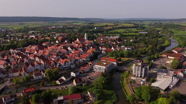 Drone shot of Riedlingen Germany highlighting St. Georg tower historic Old Town Danube River red roof skyline and traditional European architecture in the Biberach district