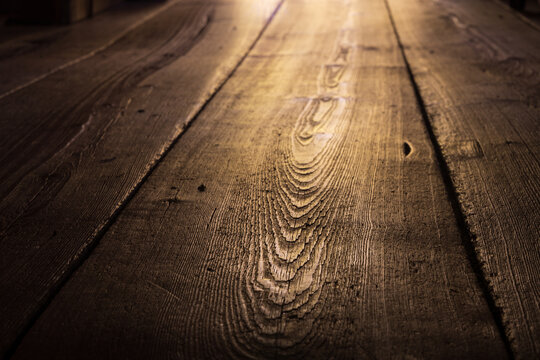 Old worn longleaf pine flooring in a cabin in North Carolina