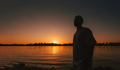 Fototapeta premium Silhouette Man Watching Peaceful Sunset Horizon