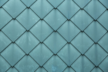 Diamond shaped fish scale tiled wall texture background © EnginKorkmaz