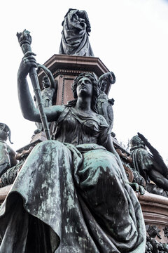 Detail from and old bronze statue in Munich