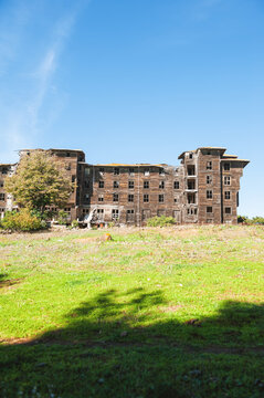 Abandoned wooden building with weathered facade showing decay and forgotten charm