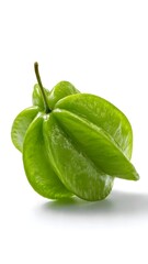 Obraz premium Fresh Green Starfruit (Carambola) Close-Up On White Background, Tropical Healthy Fruit Photography