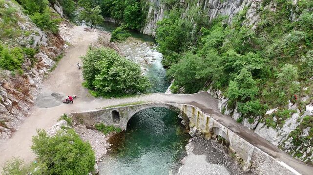 Drone Orbit Around Ura e Vashes Historic Landmark in Northern Albania