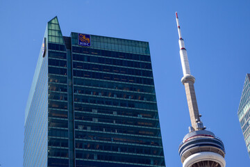 Naklejka premium Toronto, Ontario, Canada - June 19, 2018: Royal Bank of Canada (RBC) office in RBC Centre on Wellington St W with CN Tower in the background in downtown Toronto, Ontario, Canada.