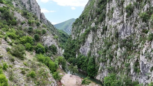 Cinematic Drone Flight Above Mat River Between Mountains at Ura e Vashes Albania