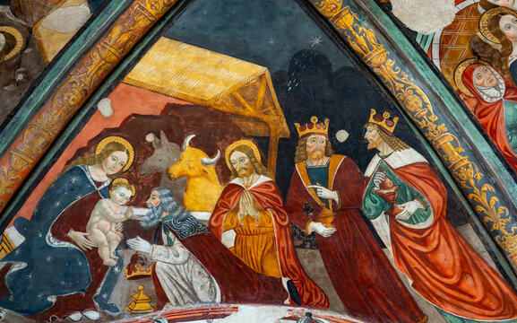 Fresco of Christmas Nativity Scene : Adoration of the Magi as they present gifts of gold, frankincense and myrrh to the Infant Jesus.