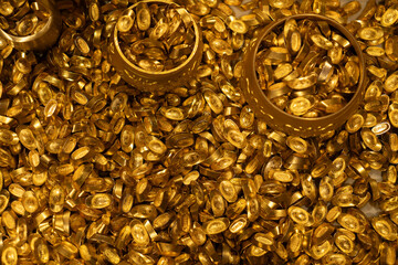 Piles of Traditional Chinese Gold Ingots and Golden Bowls © onlyyouqj