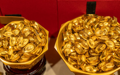 Piles of Traditional Chinese Gold Ingots and Golden Bowls © onlyyouqj