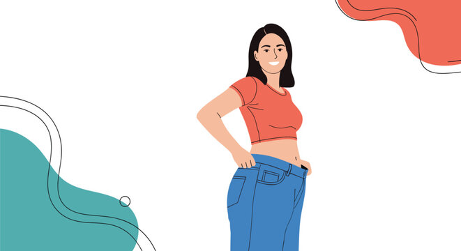 Happy young woman celebrates her successful weight loss journey by showing how her old denim jeans are now too large.