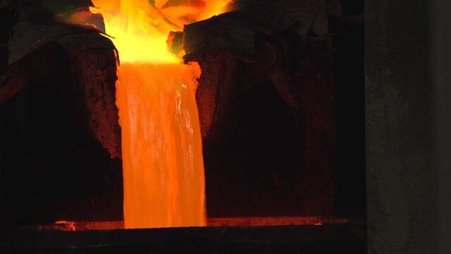 Luminous Metal Casting. Industrial Foundry Operation Featuring Molten Metal And Safety Protocols . Stock clip