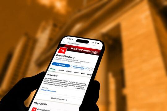 Kiel, Germany - 06-02-2026: LinkedIn profile of CrowdStrike United States cybersecurity technology company displayed on smartphone in office environment