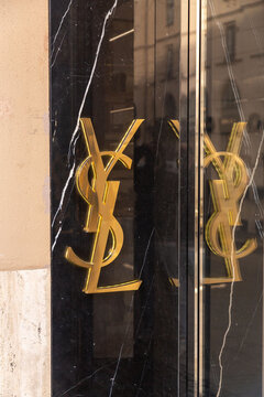 Yves Saint Laurent sign and logo at the entrance of luxury stores on Maximilanstrasse, Maximilian Street in Munich, Germany