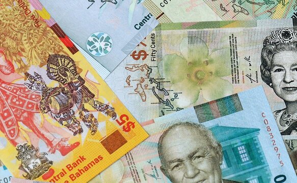 Bahamian dollar money banknotes bunch on table. Bahamas bills of BSD currency close up