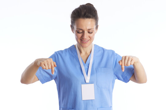 Friendly Female Physician Pointing Down - Medical Call to Action