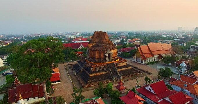 A breathtaking aerial view of Wat Chedi Luang, one of Chiang Mai&rsquo;s most important temples, located in the ancient walled city. The massive brick stupa rises above historic surroundings