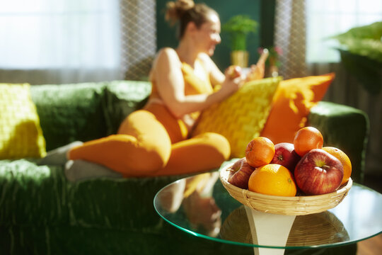 Fresh Fruit Basket with Woman Relaxing in Background
