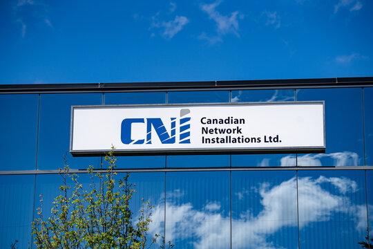 Close up of CNI Canadian Network Installations logo on office building sign. Markham, Canada - May 30, 2026.