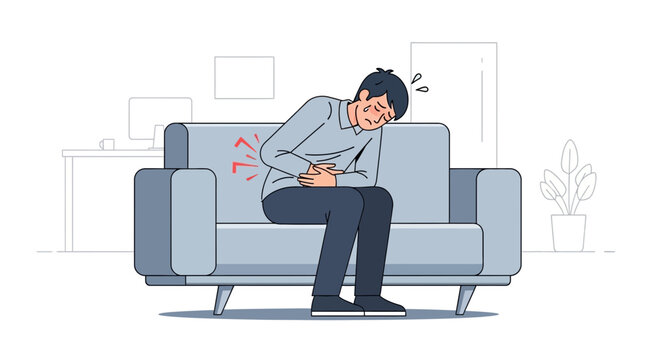 Man In Distress, Experiencing Acute Abdominal Pain, Sitting Uncomfortably On A Sofa