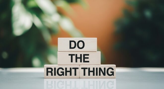 Wooden blocks spell 'do the right thing' with blurred garden background