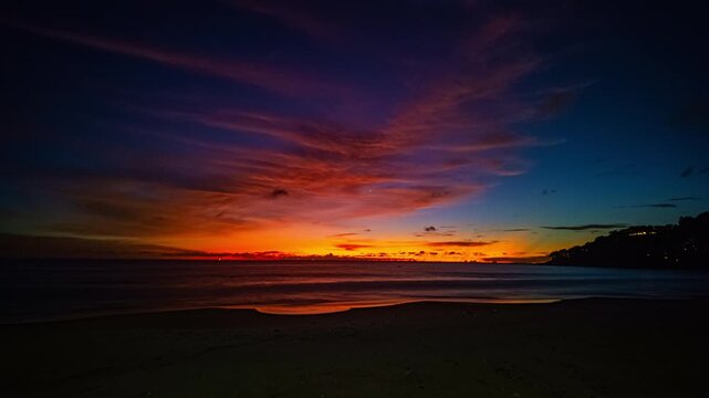 
This tropical beach scene showcases a breathtaking sunset sky gradient above coconut trees, where changing light and drifting clouds create a mesmerizing time-lapse display.