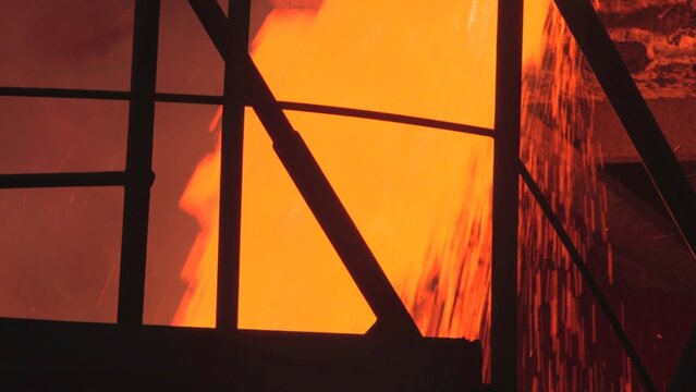 Intense Stream Of Molten Substance Overflows Protective Barrier Into Foggy Containment Zone . Stock clip