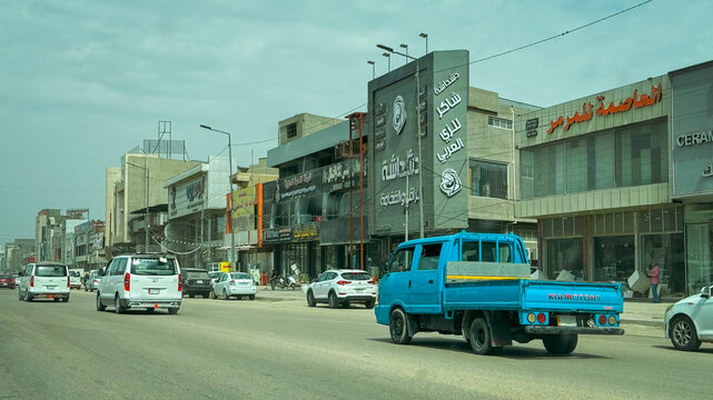 Baghdad, Iraq - March 22, 2025: Busy street in Baghdad showcases urban life and local commerce during daytime