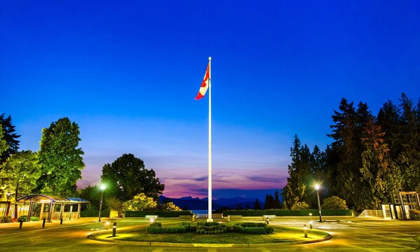 Canadian Flag on Main Mall at University of British Columbia in Vancouver at sunset on June 23, 2023