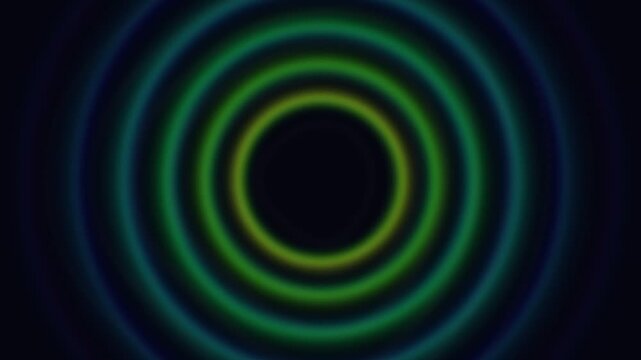 Abstract digital art featuring concentric circles with a vibrant gradient of blues greens and yellows radiating outwards from a dark central point creating a mesmerizing visual effect of depth