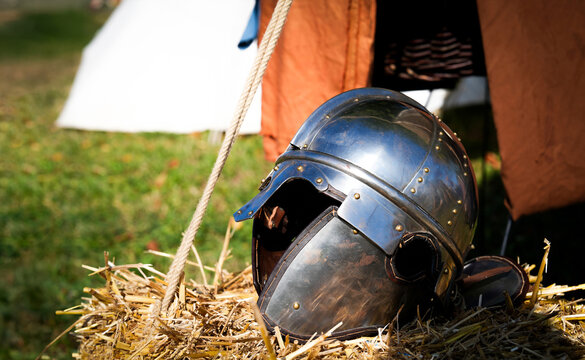 Augusta Raurica, Kaiseraugst, Switzerland, 28 August 2024: The helmet of the Roman soldier lies on the hay. The Roman legionaries' camp during the Roman Festival in Augusta Raurica, R&ouml;merfest. Basel.