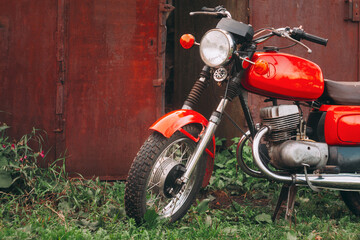 Fototapeta premium Vintage Red Motorcycle Generic Motorbike Countryside