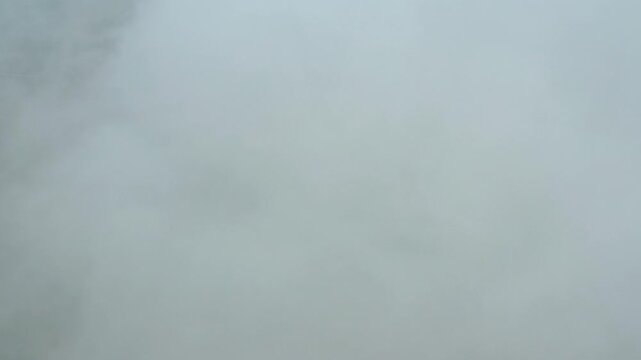 The drone flies through clouds of smoke. Dangerously poor air quality.
