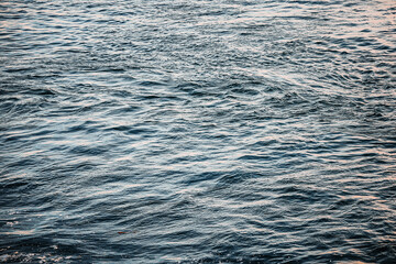 Obraz premium Deep Blue Ocean Water Surface with Waves and White Foam Texture
