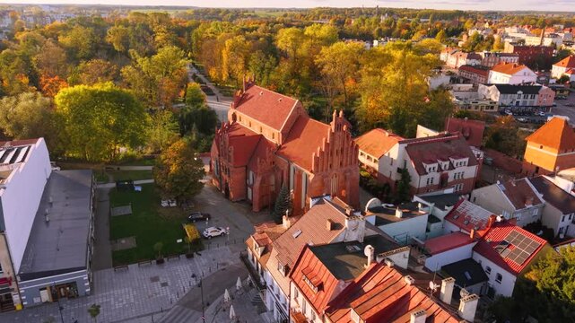 The market square in Starogard Gdanski in the light of the setting sun at autumn. Poland