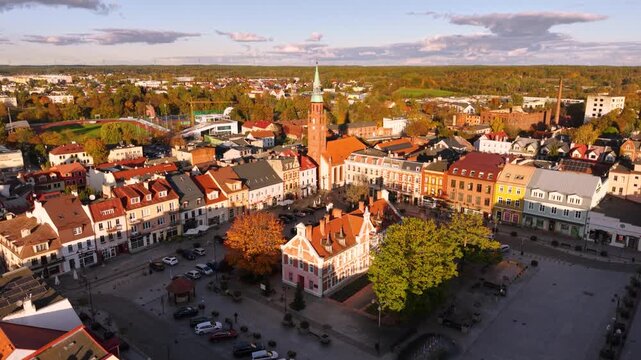 The market square in Starogard Gdanski in the light of the setting sun at autumn. Poland