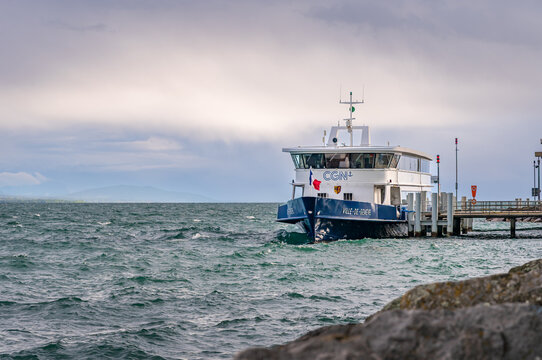 CGN Boat on Lake Geneva Under Dramatic Cloudy Sky in Switzerland.