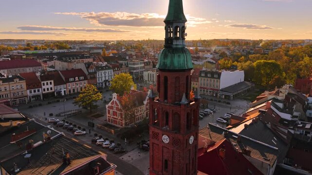 The market square in Starogard Gdanski in the light of the setting sun at autumn. Poland