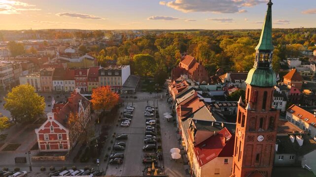 The market square in Starogard Gdanski in the light of the setting sun at autumn. Poland
