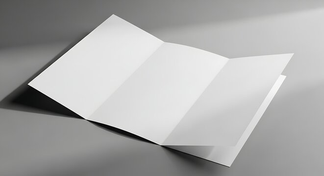 Unfolded blank tri-fold brochure with soft shadows on gray background