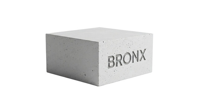 White concrete block with the word dix written in silver foil block.