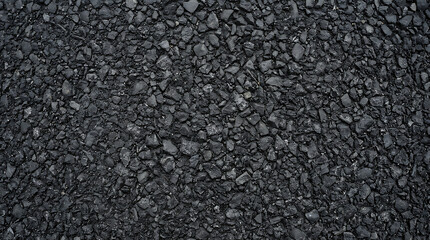 Fototapeta premium Seamless dark black asphalt texture background with crushed stones and bitumen surface for road construction industrial pavement and infrastructure
