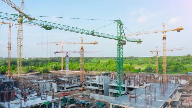 Construction site overview of tower cranes and residential development in an active urban construction zone
