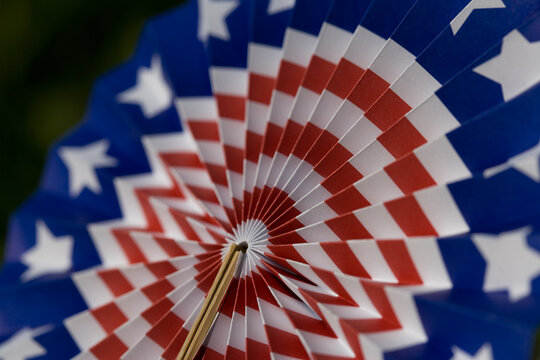 Patriotic American flag fan decoration with red, white & blue stars and stripes: festive graphic americana symbol of democracy, freedom, government, veterans & United States federal holidays.