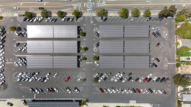 Top down drone view of solar panel carports over a parking lot