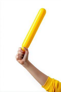 Hand holding bright yellow inflatable cheer stick support banner for cheering or sports fan enthusiasm isolated on white background