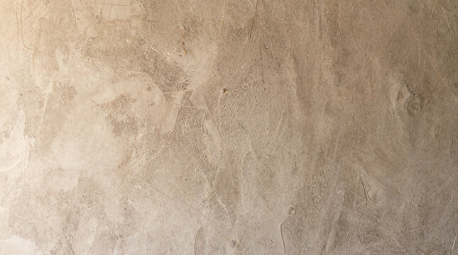 Texture of decorative beige plaster background with textured wall surface
