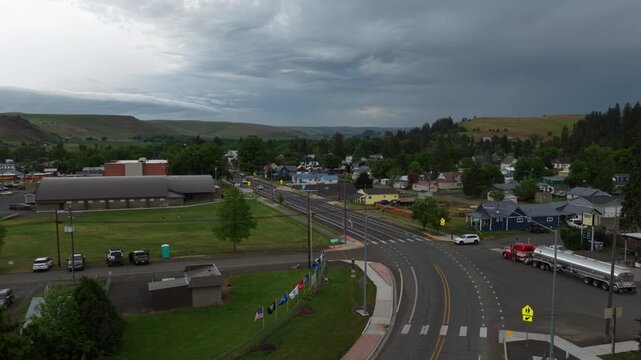 Spring time aerial in Wallowa Oregon small rural town with stormy sky