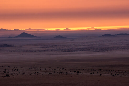 Magic landscape of distant hills on the baren forsaken plains of the southern Namib Desert.