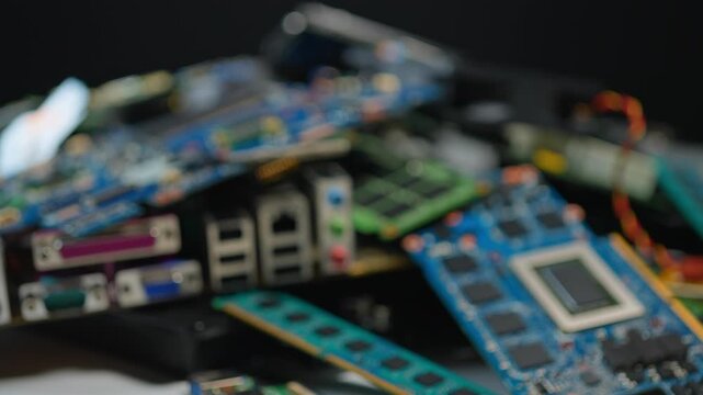 Aftermath of AI booming economy, e-waste pile of computer components with valuable rear earth metals, sustainability issues. Data centers powering AI upgrades and equipment replacements concept.