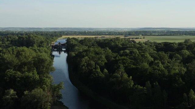Scenic view of the confluence of the Vltava and Elbe (Labe) rivers near Měln&iacute;k Castle in the Czech Republic. Beautiful Central European landscape with flowing waterways, green riverbanks, historic sur